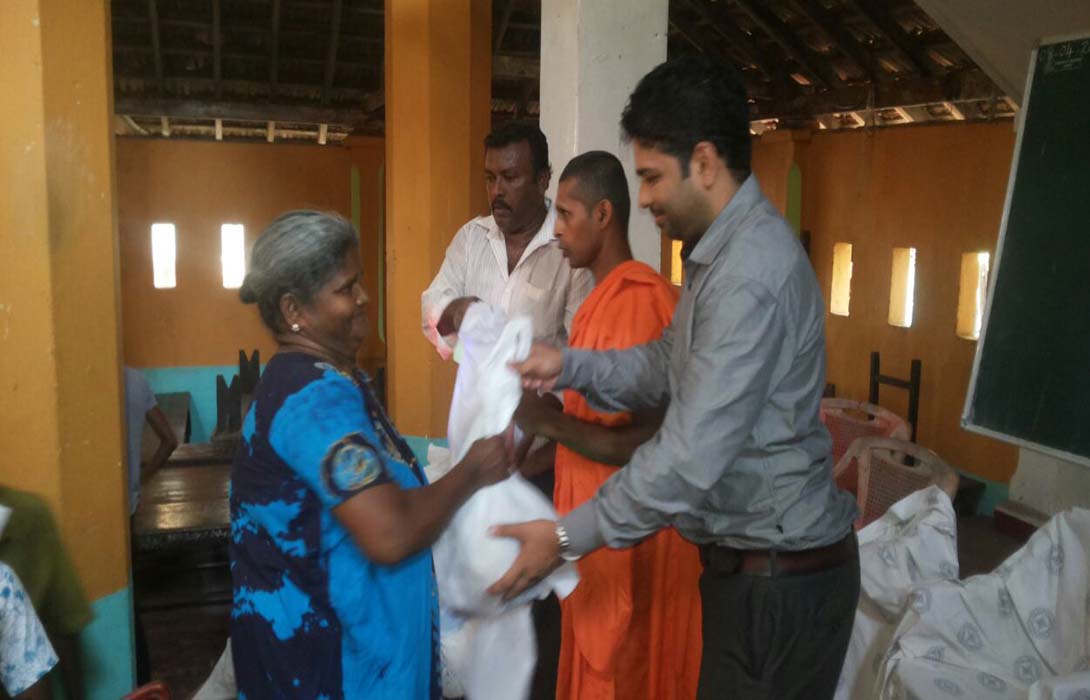 Distribution of Dry Ration by Mr. Vishnu Raj on 12th April 2016 at Paramananda Viharaya Kotahena. Mohamed Akram invited as Guest